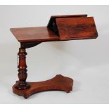 A Victorian rosewood bed table, having rise-and-fall action, hinged bookrest to platform base on