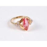 An 18ct padparadscha sapphire and diamond ring, the marquise padparadscha, approx. 13mm long, set to