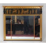 A mid-19th century Egyptian Revival overmantel mirror, the frieze classically painted with a Roman