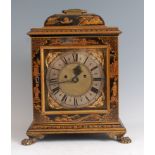 A late 19th century chinoiserie black lacquered bracket clock, having brass swing carry handle,