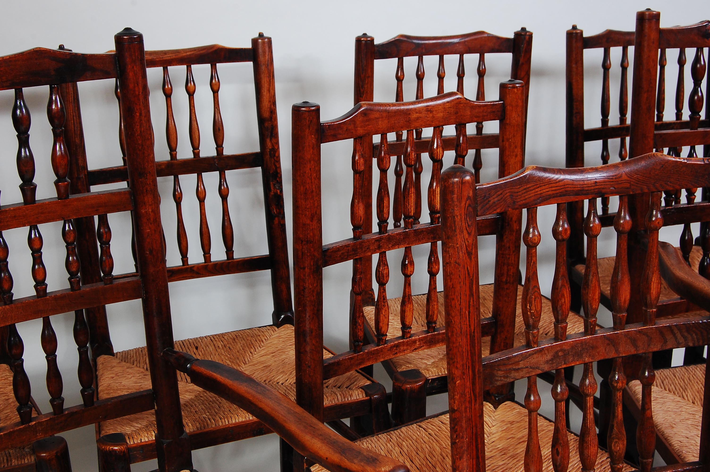 A set of eight Lancashire elm spindleback chairs, each having replacement rush seats, turned - Image 2 of 3