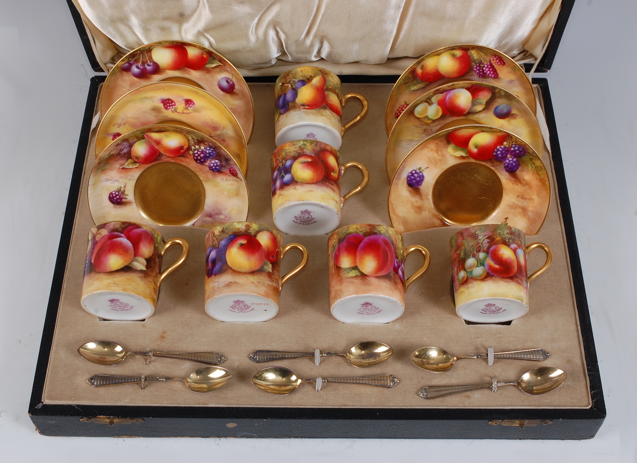 *A cased matched set of Six Royal Worcester porcelain coffee cans and saucers, each piece hand-