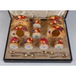 *A cased matched set of Six Royal Worcester porcelain coffee cans and saucers, each piece hand-