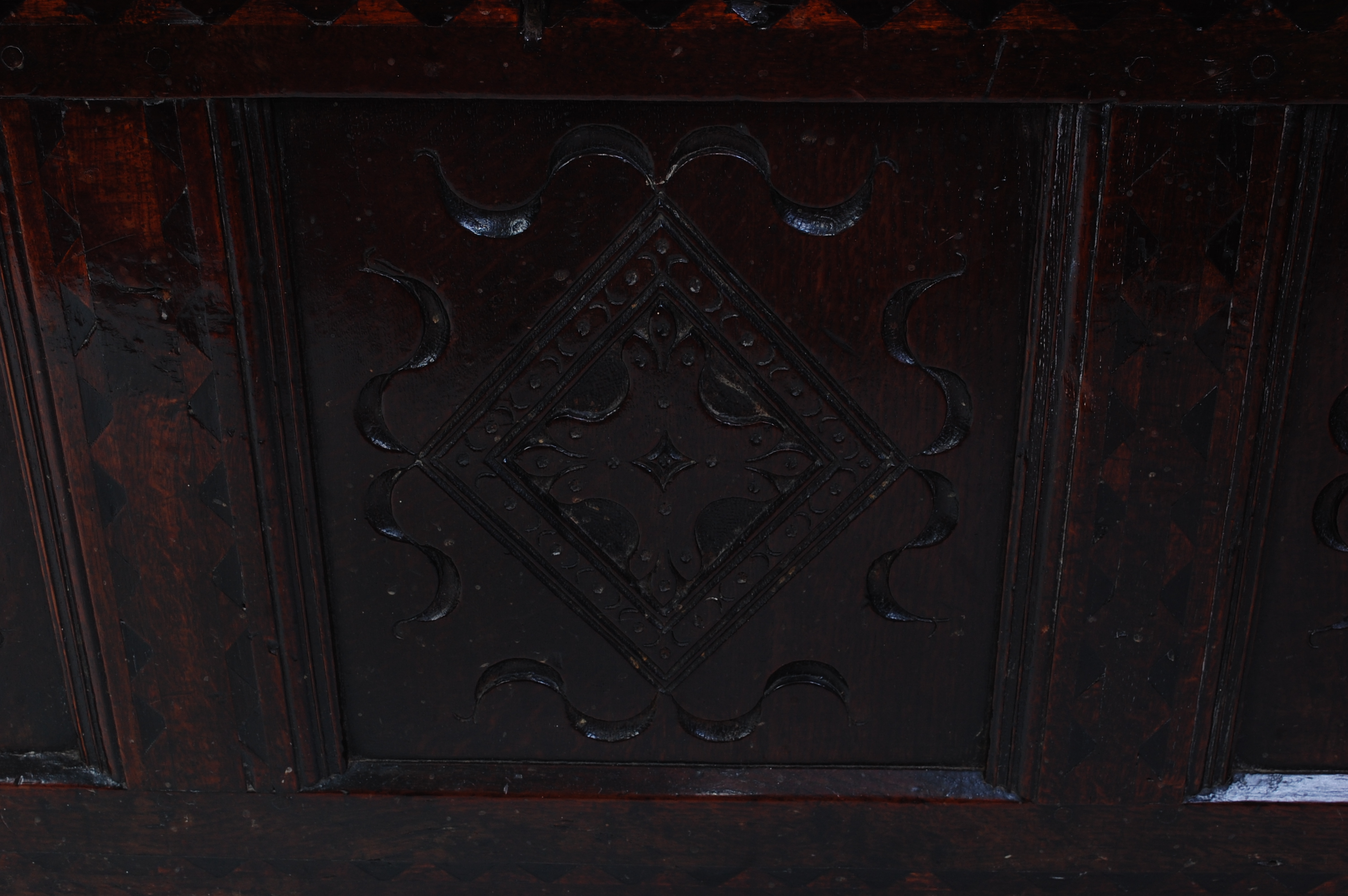 *An 18th century joined oak coffer, the two-plank top on split ring hinges, above a carved three - Image 6 of 6