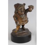 A late Victorian bronze match-striker, modelled as a portly standing figure holding a jug of ale