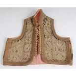 A 19th century Ottoman bullion waistcoat, having silk lining, the cotton ground finely embroidered