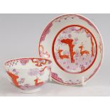 A Lowestoft porcelain tea bowl and stand, polychrome decorated in the Deer Park pattern, in tones of