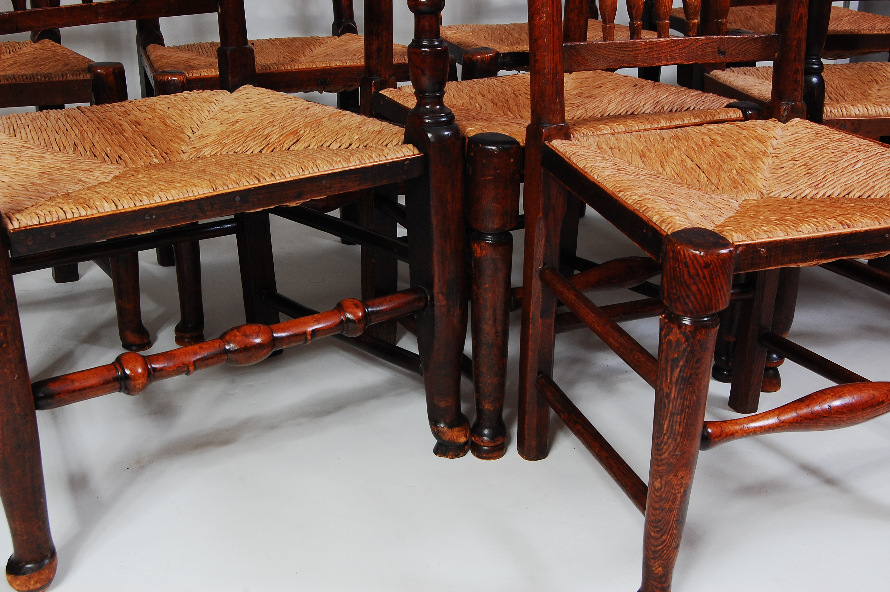 A set of eight Lancashire elm spindleback chairs, each having replacement rush seats, turned - Image 3 of 3