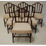 A matched set of thirteen Hepplewhite style mahogany dining chairs, each having a shield shaped back