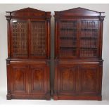 A pair of circa 1830 Scottish mahogany library bookcases, each having architectural pediments over