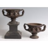 A pair of late 19th century patinated bronze models after the Warwick Vase, each cast in relief with