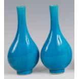 A pair of Chinese bottle vases, each of ovoid form with turquoise glaze, unmarked, h.23cm