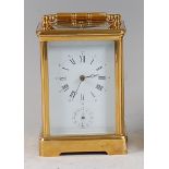 A French brass carriage clock, 20th century, having push button hour and half-hour repeat and alarm,