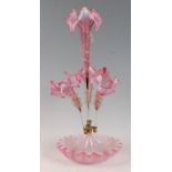 A Victorian vaseline glass and cranberry tinted four trumpet epergne, with folded circular base, h.