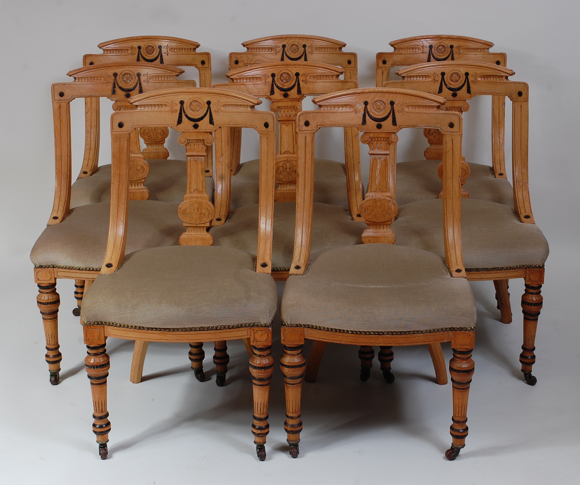 *A set of eight late Victorian ash dining chairs, each having shaped back with central column shaped