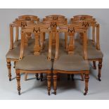 *A set of eight late Victorian ash dining chairs, each having shaped back with central column shaped