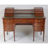 A Sheraton Revival mahogany and satinwood crossbanded writing desk, having raised superstructure