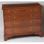 A figured walnut and crossbanded bachelors chest, in the early 18th century style, the fold-over top