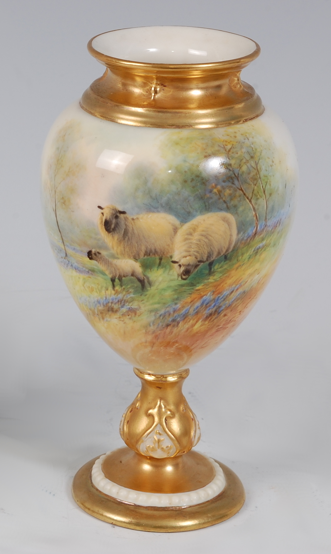 *A Royal Worcester porcelain ovoid pedestal vase, hand-painted with sheep and lamb amidst a