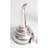 *An early 19th century unmarked white metal (tests as silver) two-piece wine funnel, the bowl