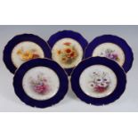 *Five Royal Worcester cabinet plates, each painted to the centre with flowers within wide cobalt