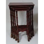 A Japanese Meiji period quartetto nest of occasional tables, each having rectangular red lacquered