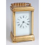 A French gilt brass gorge cased carriage clock, circa 1870, having a white enamel dial (hairline),