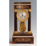 A 19th century French rosewood and marquetry inlaid portico clock, having gilt metal mounts,