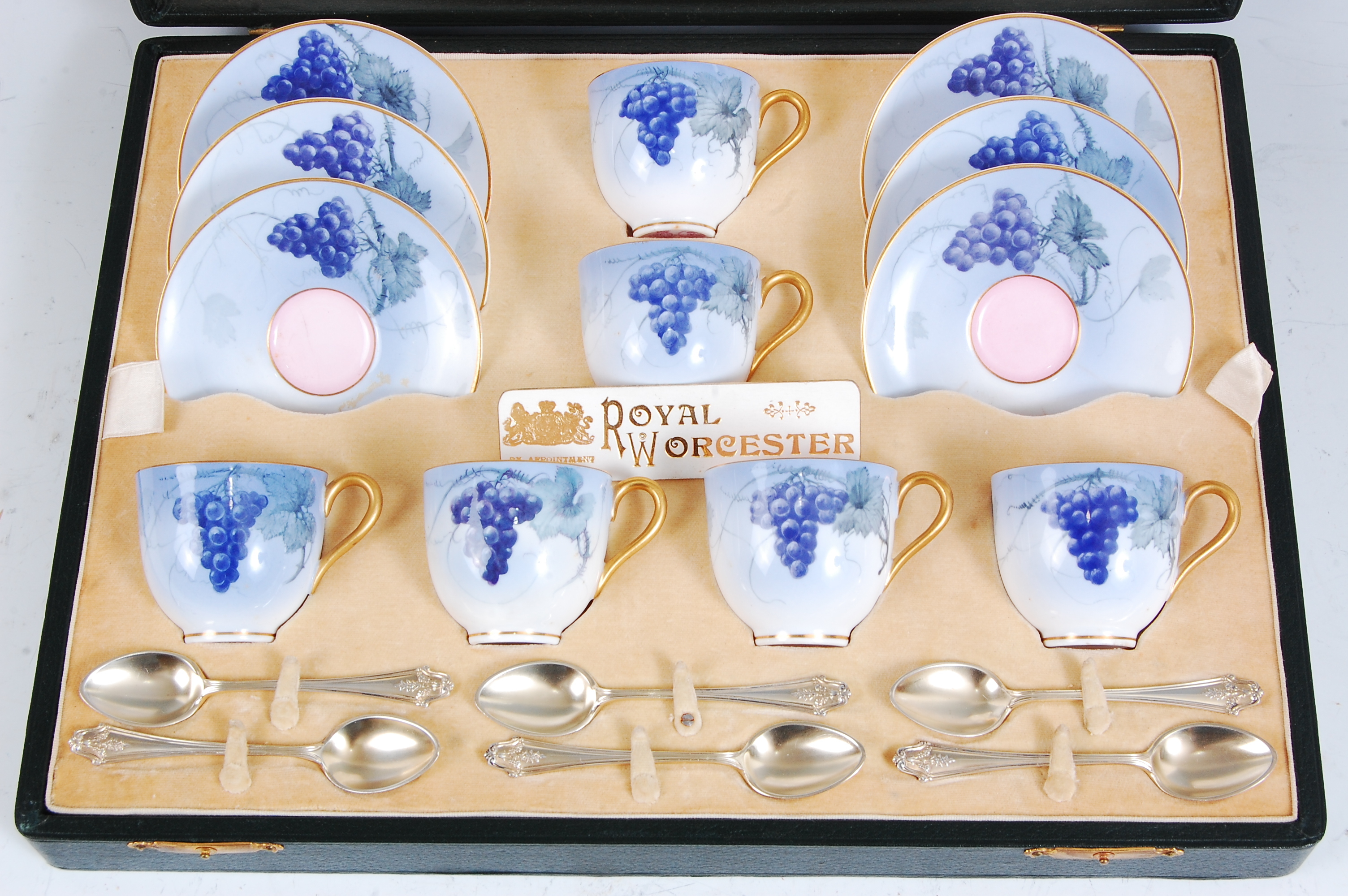 *A cased set of six Royal Worcester coffee cups and saucers, each piece on a light blue ground