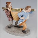*A Royal Worcester porcelain figure group, modelled as two men in standing pose with a branch upon