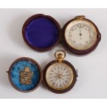 An early 20th century aneroid pocket barometer, having unsigned silvered dial, gilt metal case,