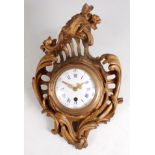 A 19th century French Rococo Revival carved giltwood and composition cartel clock, the swept case