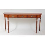 A satinwood three drawer hall table, in the 18th century style, raised on slender turned and