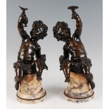 A large pair of late 19th century French bronze young Bacchanalian putti, each modelled as