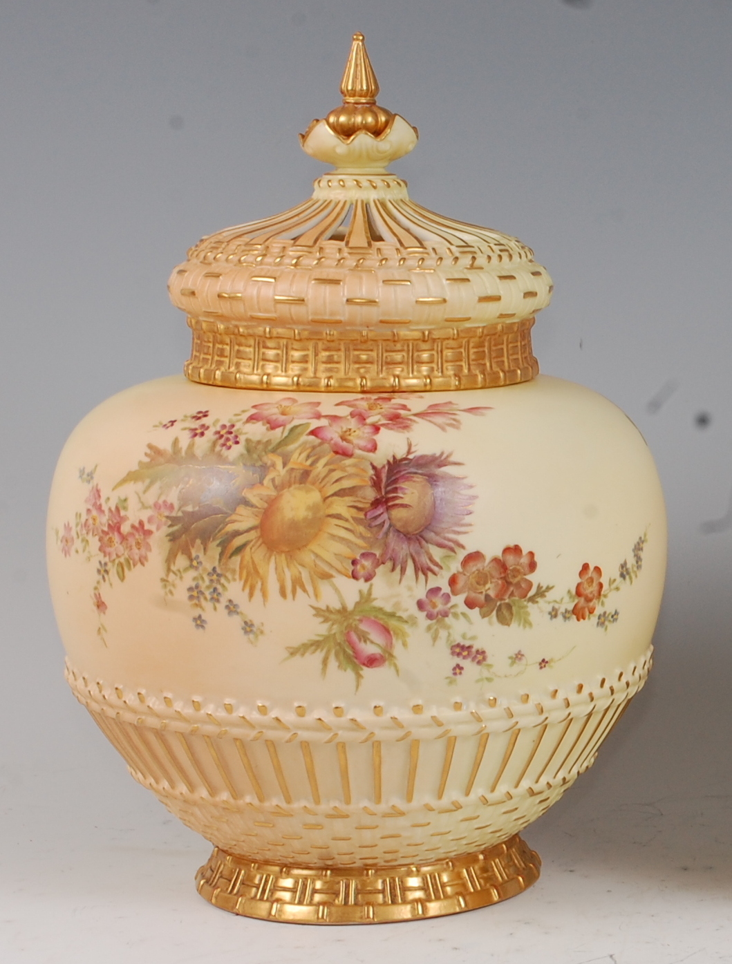 *A large Royal Worcester porcelain blush ivory pot pourri, of globular form, having pierced dome