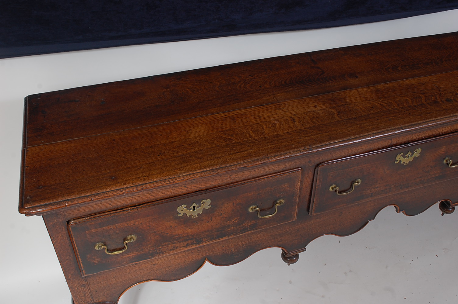 A George III North Country oak and mahogany crossbanded dresser base, the two-plank top having a - Image 2 of 8