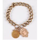 A 9ct charm bracelet, the 9ct curblink charm bracelet, set with a 9ct medallion dated 1922, and an
