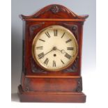 A Victorian mahogany bracket clock, having a serpentine top, white enamel dial, single winding
