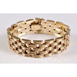 A 9ct bracelet, the 18mm wide brick link bracelet with concealed clasp and double safety catch,