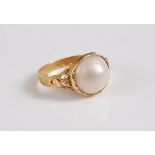 A late 19th century 18ct mabe 'pearl' ring, the round mabe pearl, approx. 11.2mm diameter, in collet