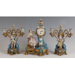 A 19th century French porcelain and ormolu three-piece clock garniture, the clock modelled as a