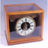 An electric 'rolling ball' clock, apparently made-up, the whole housed in glazed wooden case, the