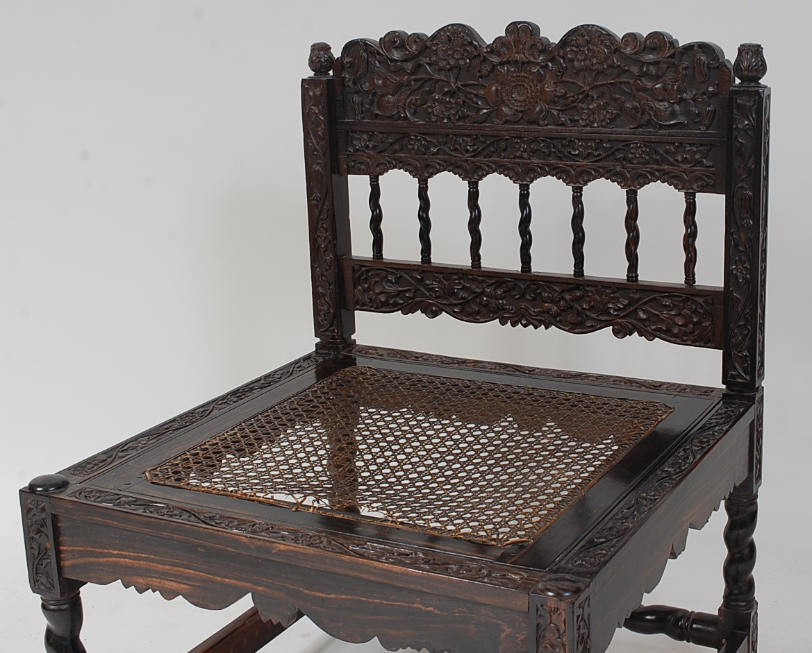 A Ceylon relief carved calamander nursing chair, having drop in cane seat, with spiral turned - Image 2 of 3