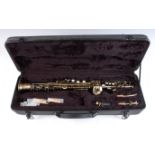 A cased lacquered straight Soprano saxophone, unstamped