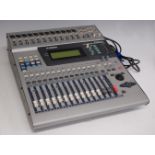 A 1990s Yamaha 01v digital mixing console, with owner's manual