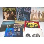 Eight vinyl LP records by The Doors, comprising The Doors 1967, Strange Days 1967, Waiting for the