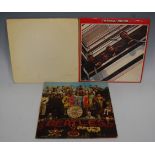 Three vinyl LP records by The Beatles, comprising The Beatles Red Album 1962-1966, Sgt Pepper's