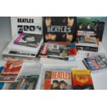 A quantity of Beatles ephemera, to include various hardback volumes, 45 vinyl records, DVDs etc