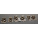 A set of 6 contemporary silver menu stands modelled as top hats