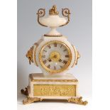 A 19th century onyx and gilt metal mounted mantel clock, the case surmounted with a pedestal urn and